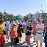 Group of travelers exploring Mumbai streets together during a guided sightseeing experience.