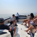 Group of cruise passengers enjoying a private speedboat ride to Elephanta Caves from Mumbai Harbour