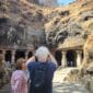 entrance view of Elephanta Caves Mumbai with rock cut pillars and visitors