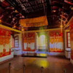 Historic Kerala palace hall decorated with traditional mural paintings