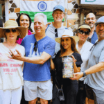 Tour group visiting a local small business during a cultural walk in Dharavi Mumbai