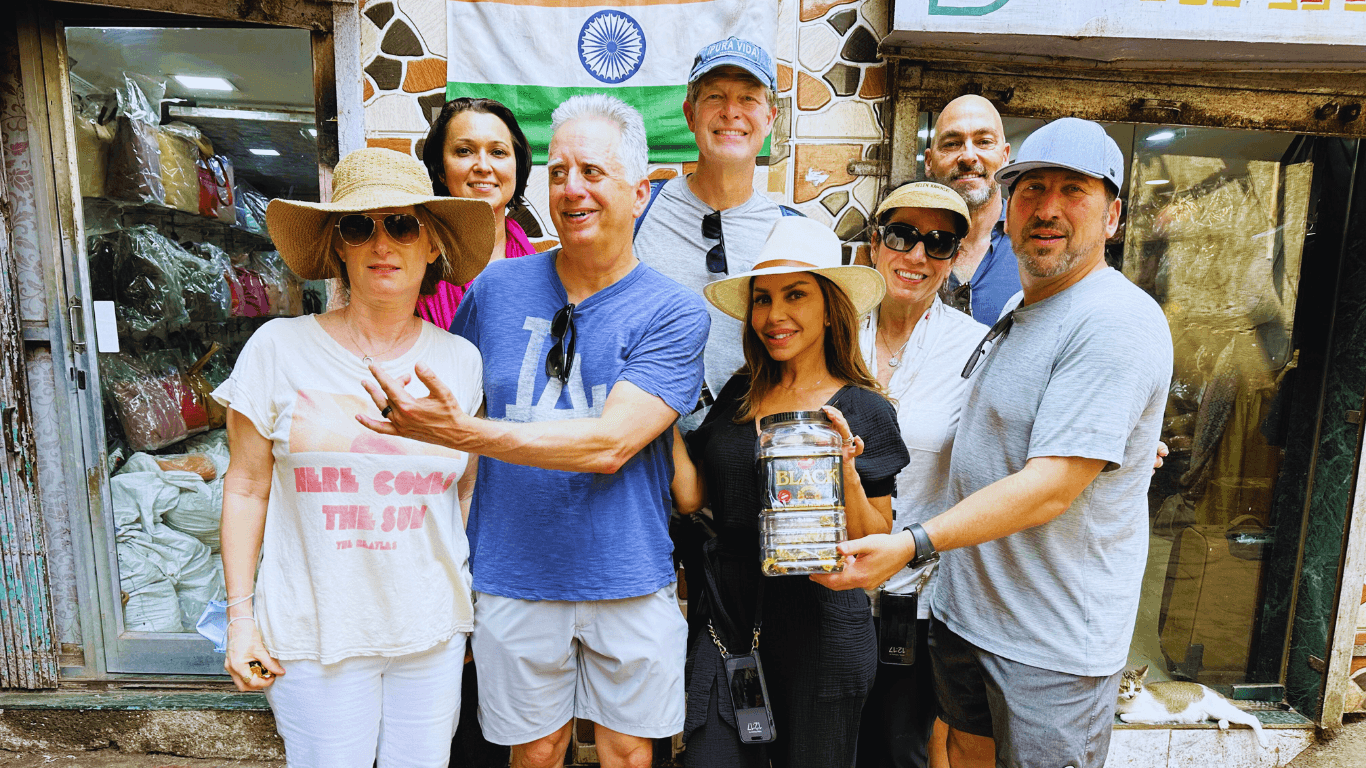 Tour group visiting a local small business during a cultural walk in Dharavi Mumbai