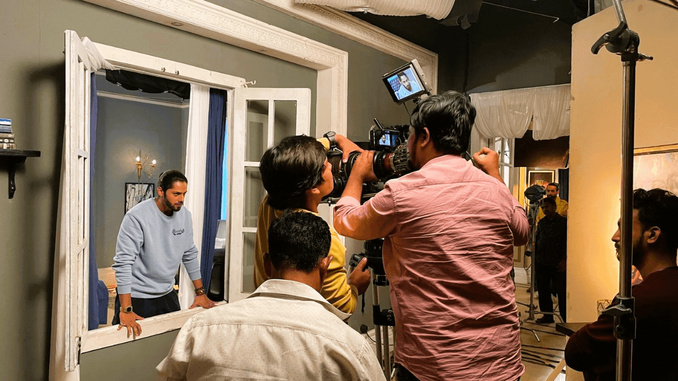 Bollywood film shooting inside Mumbai studio with camera crew and actor on set