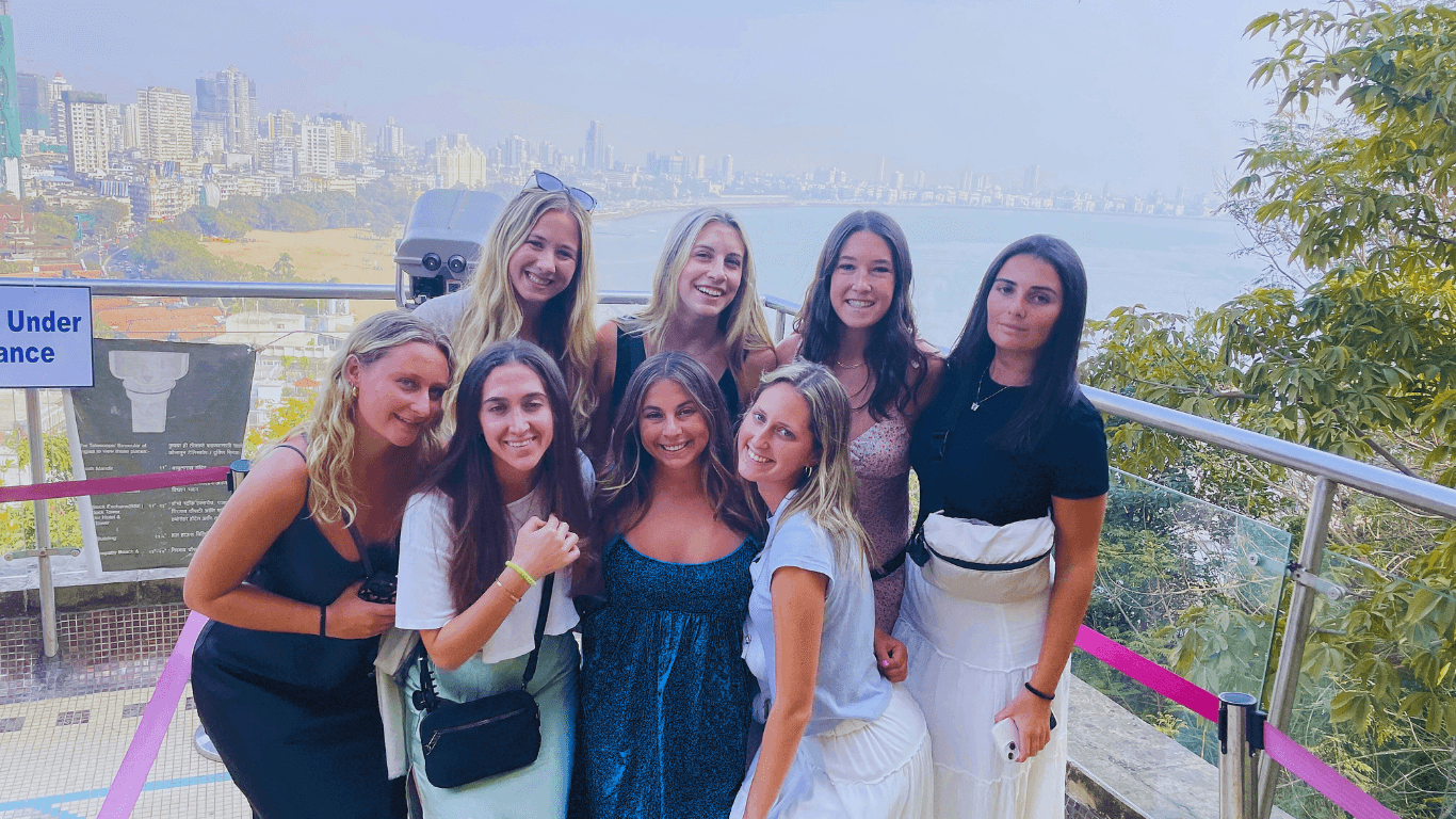 Tour group overlooking Mumbai coastline and city skyline during a guided Mumbai sightseeing tour