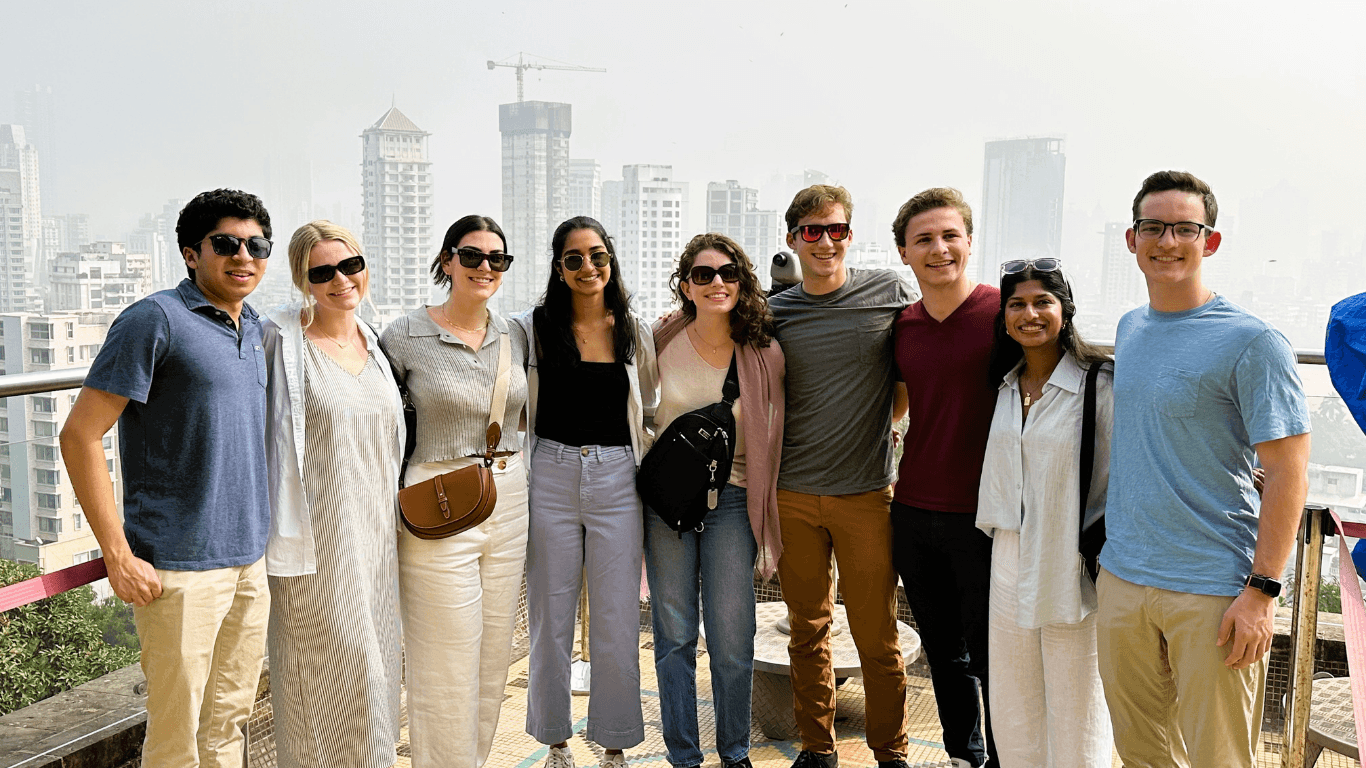 Happy tour group at Mumbai city viewpoint during a guided Highlights of Mumbai sightseeing tour