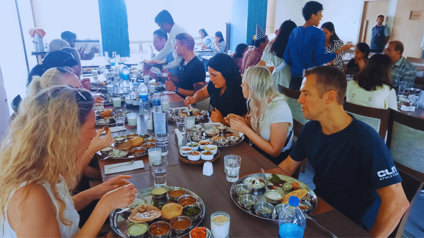 Travelers enjoying traditional Indian lunch during a guided Mumbai sightseeing tour experience
