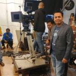 Bollywood film crew working on movie set inside Mumbai studio during guided tour visit