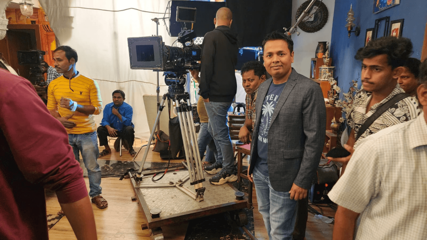 Bollywood film crew working on movie set inside Mumbai studio during guided tour visit
