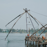 Traditional Chinese fishing nets along Goan riverbanks