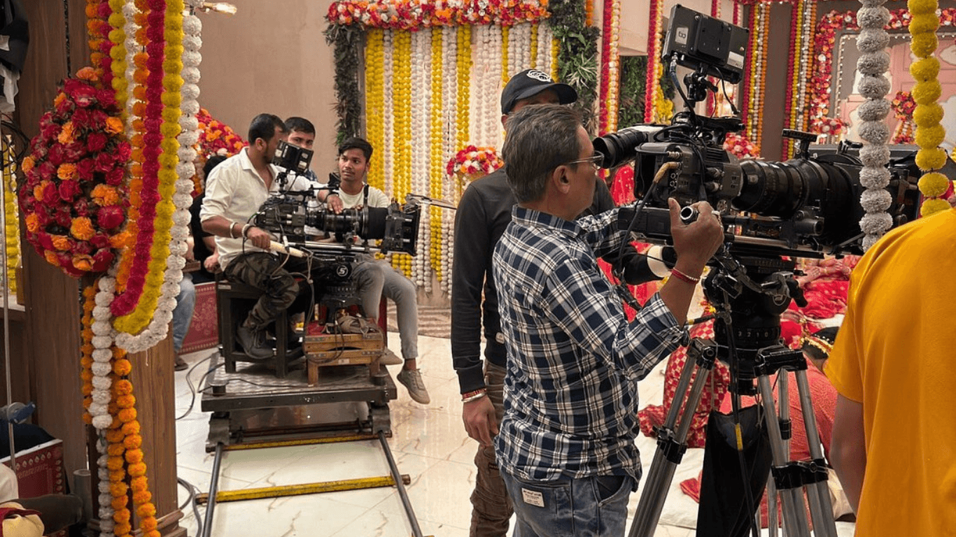 Bollywood film crew shooting a movie scene on a decorated set in Mumbai studio