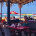 Beach shack café at Candolim Beach Goa with sunbeds, umbrellas and ocean view