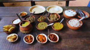 Traditional Goan vegetarian meal served on a rustic table at spice farm