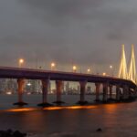 Bandra Worli Sea Link illuminated at night with Mumbai skyline and Arabian Sea
