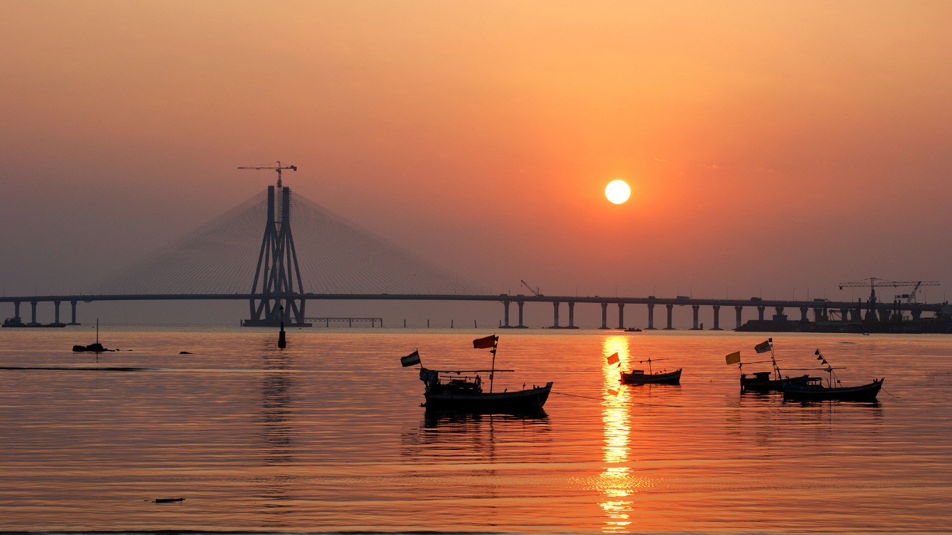 Mumbai harbour sunset with fishing boats and Bandra Worli Sea Link