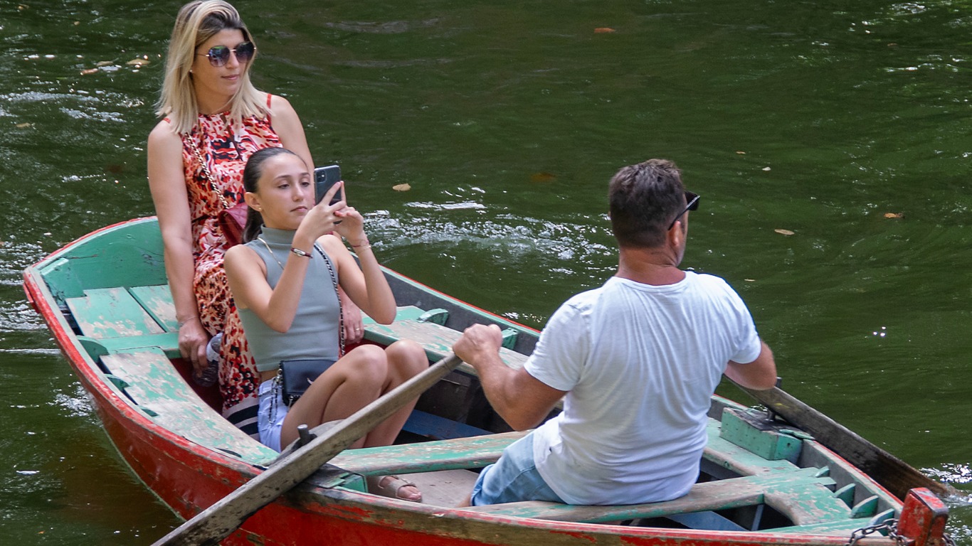 Tourists enjoying a traditional country boat ride through Kumbalangi backwaters near Kochi