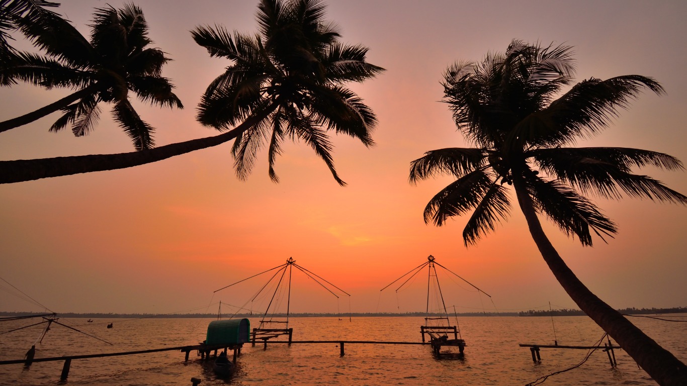 Chinese fishing nets silhouetted against sunset in Kochi backwaters near Kumbalangi