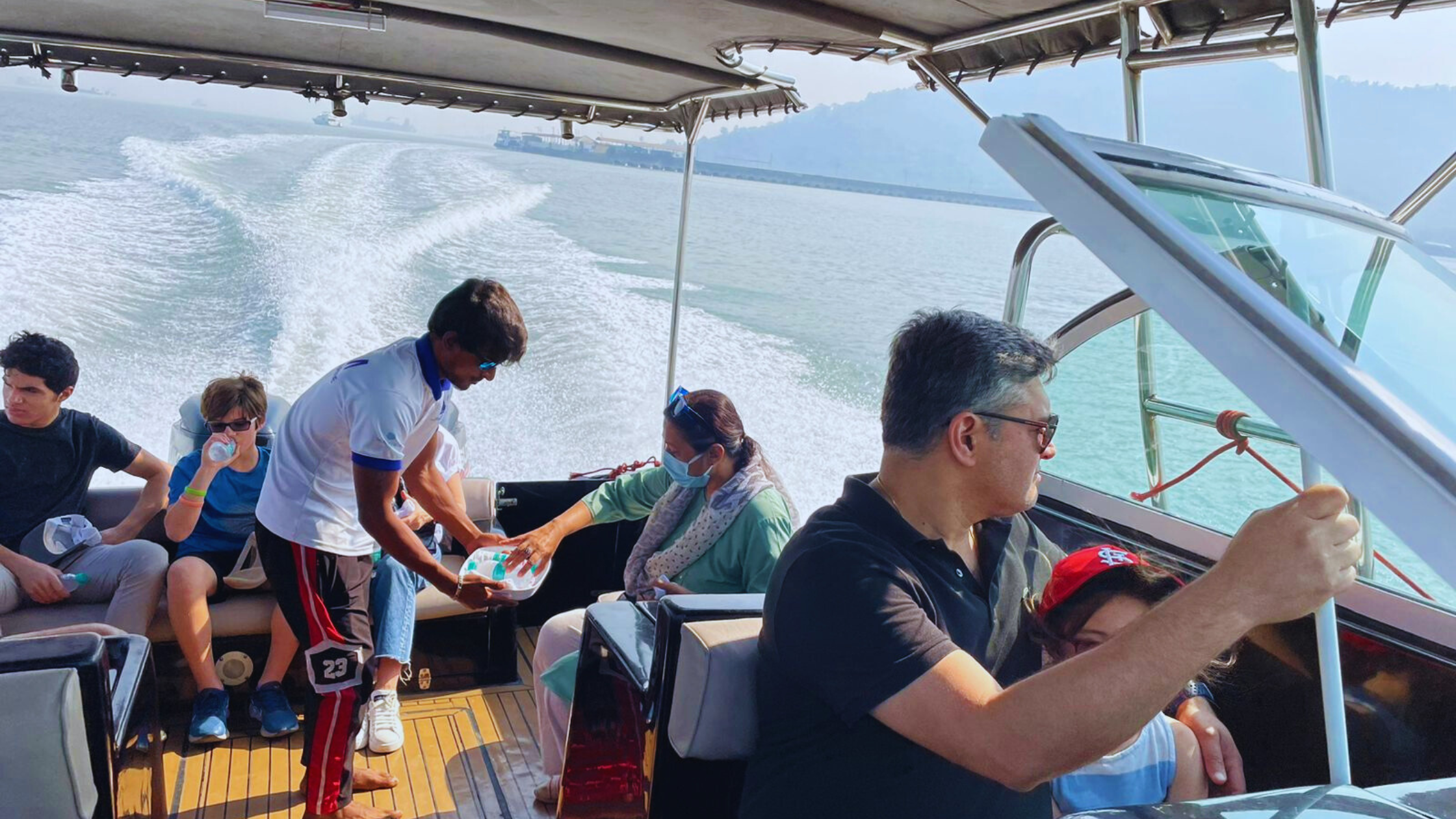 Premium speedboat transfer from Mumbai to Elephanta Caves with international travelers enjoying a fast and comfortable 20-minute journey across Mumbai Harbour