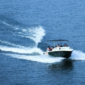 Premium speedboat traveling from Mumbai to Elephanta Caves across Mumbai Harbour, offering the fastest way to reach Elephanta Island in about 20 minutes.