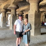Visitors exploring Elephanta Caves during a luxury Elephanta Caves private speedboat tour from Mumbai