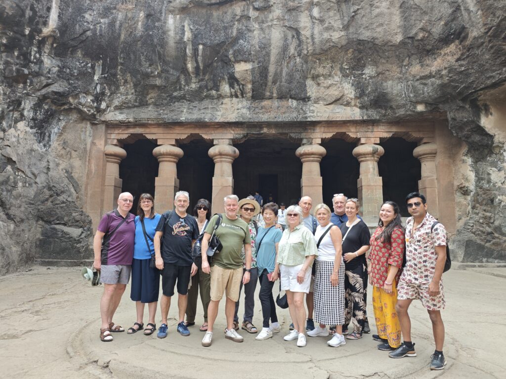 Tour group at Elephanta Caves Mumbai with guide on a speedboat tour from Gateway of India