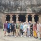 Tour group at Elephanta Caves Mumbai with guide on a speedboat tour from Gateway of India
