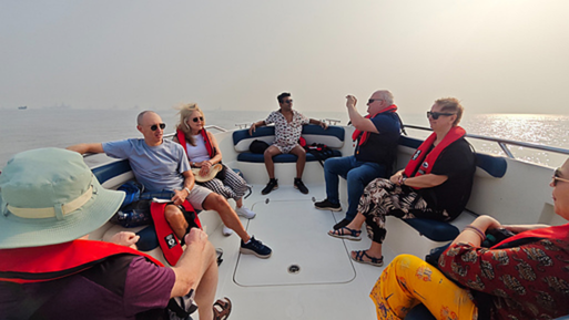 Shared speedboat travelling across Mumbai Harbour towards Elephanta Island