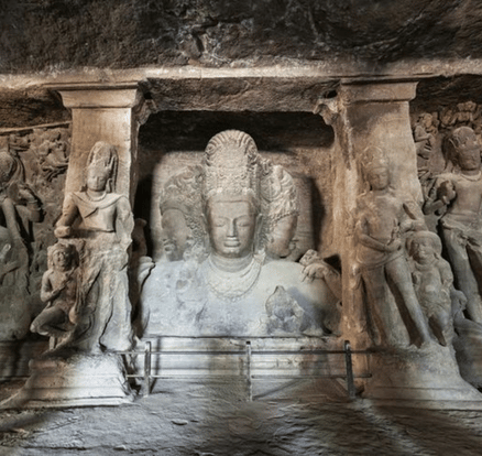 The monumental Trimurti sculpture inside the principal Elephanta cave temple